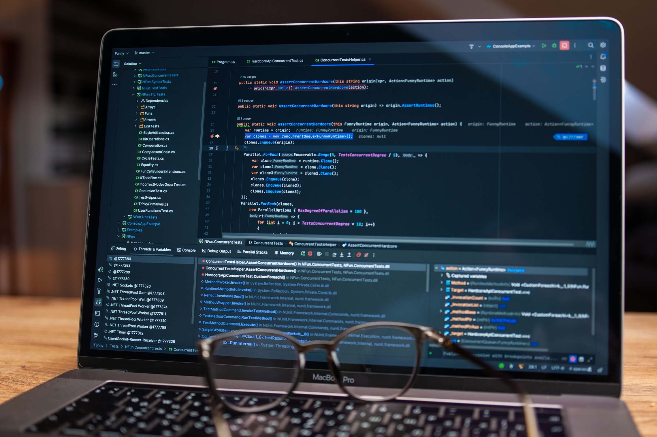 Laptop showing a terminal session during a migration task, debugging software with code on a laptop screen